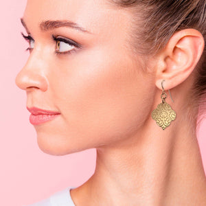 2 of 8: Fashionable Woman Wearing Damask Embossed Bronze Quatrefoil Drop Earrings