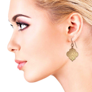 6 of 8: Chic Blonde Woman Wearing Damask Embossed Bronze Quatrefoil Drop Earrings