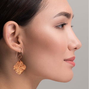 6 of 7: Chic Woman Wearing Damask Embossed Copper Quatrefoil Drop Earrings