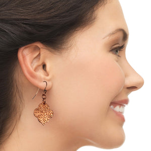 4 of 7: Elegant Woman Wearing Damask Embossed Copper Quatrefoil Drop Earrings