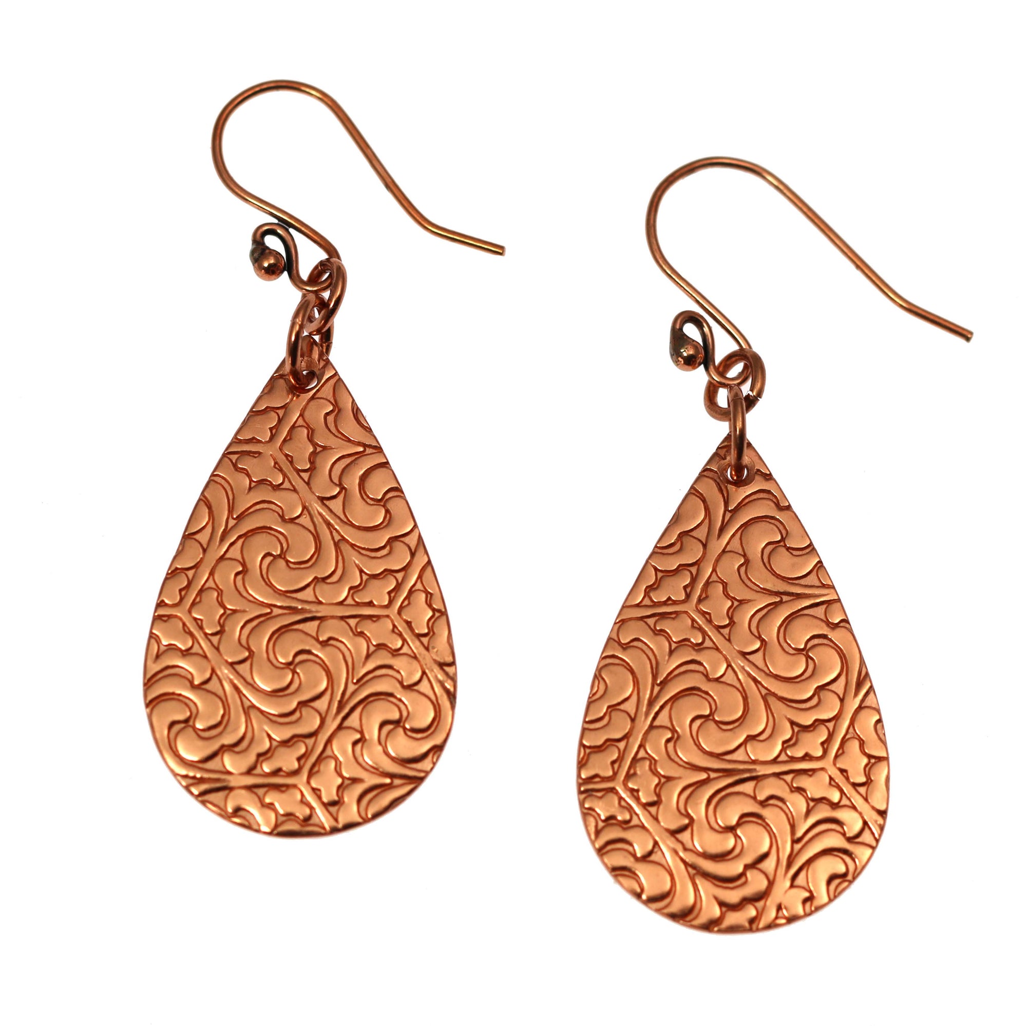 A Pair of Damask Embossed Small Copper Teardrop Earrings on a White Background