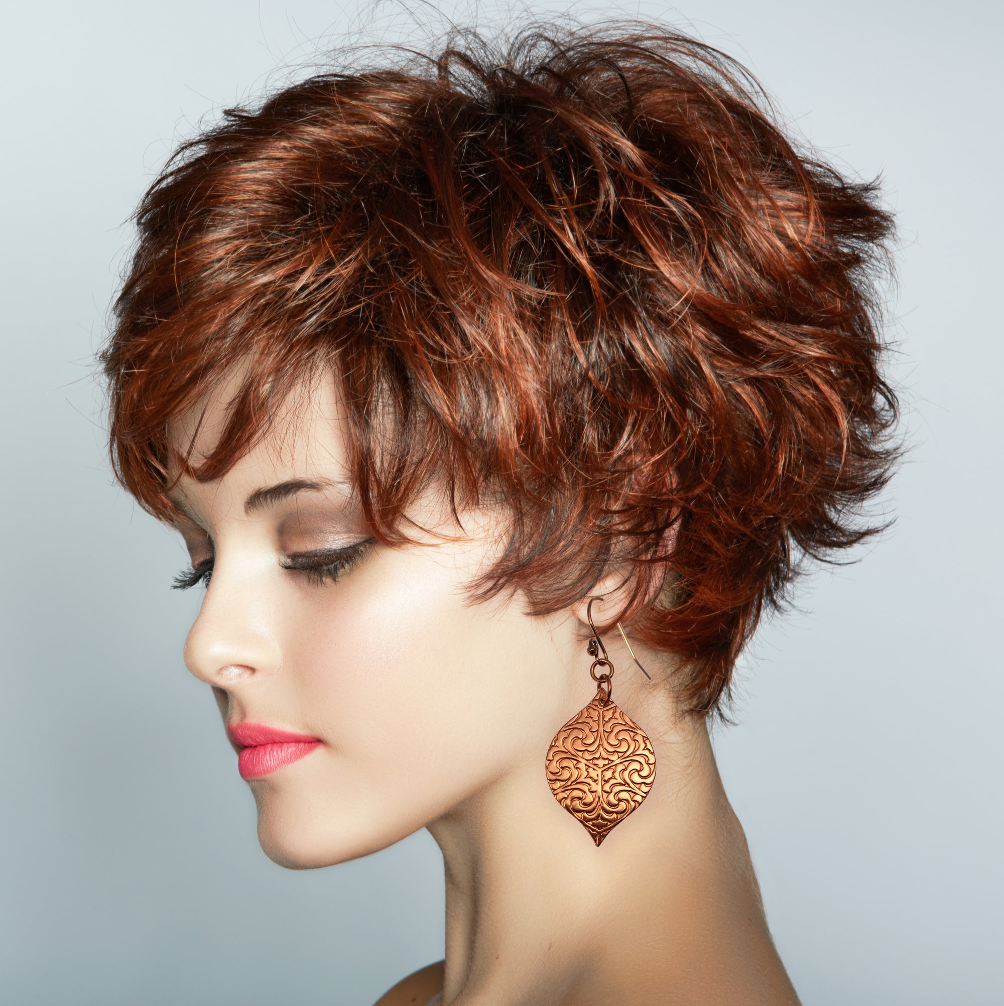 Redhead Wearing Damask Embossed Marrakesh Copper Drop Earrings
