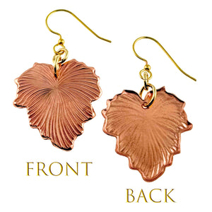 3 of 7: A pair of handcrafted copper grape leaf dangle earrings shown from both the front and back. The front view highlights the detailed, die-struck veining that mimics real grape leaves, while the back view shows a smoother, lightly textured surface. Both earrings feature brass French hook ear wires. The warm copper finish gives a natural, elegant look.