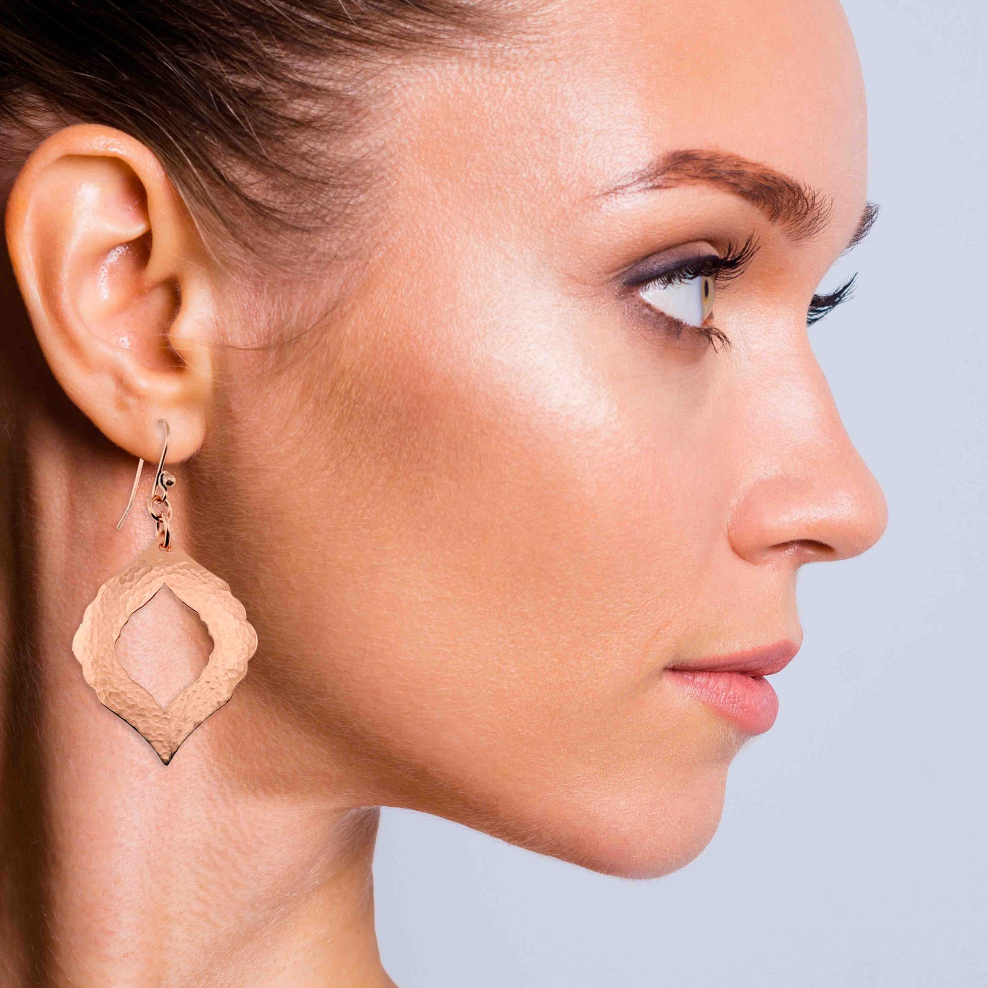 A Stunning Woman Wearing Hammered Copper Pierced Moroccan Drop Earrings