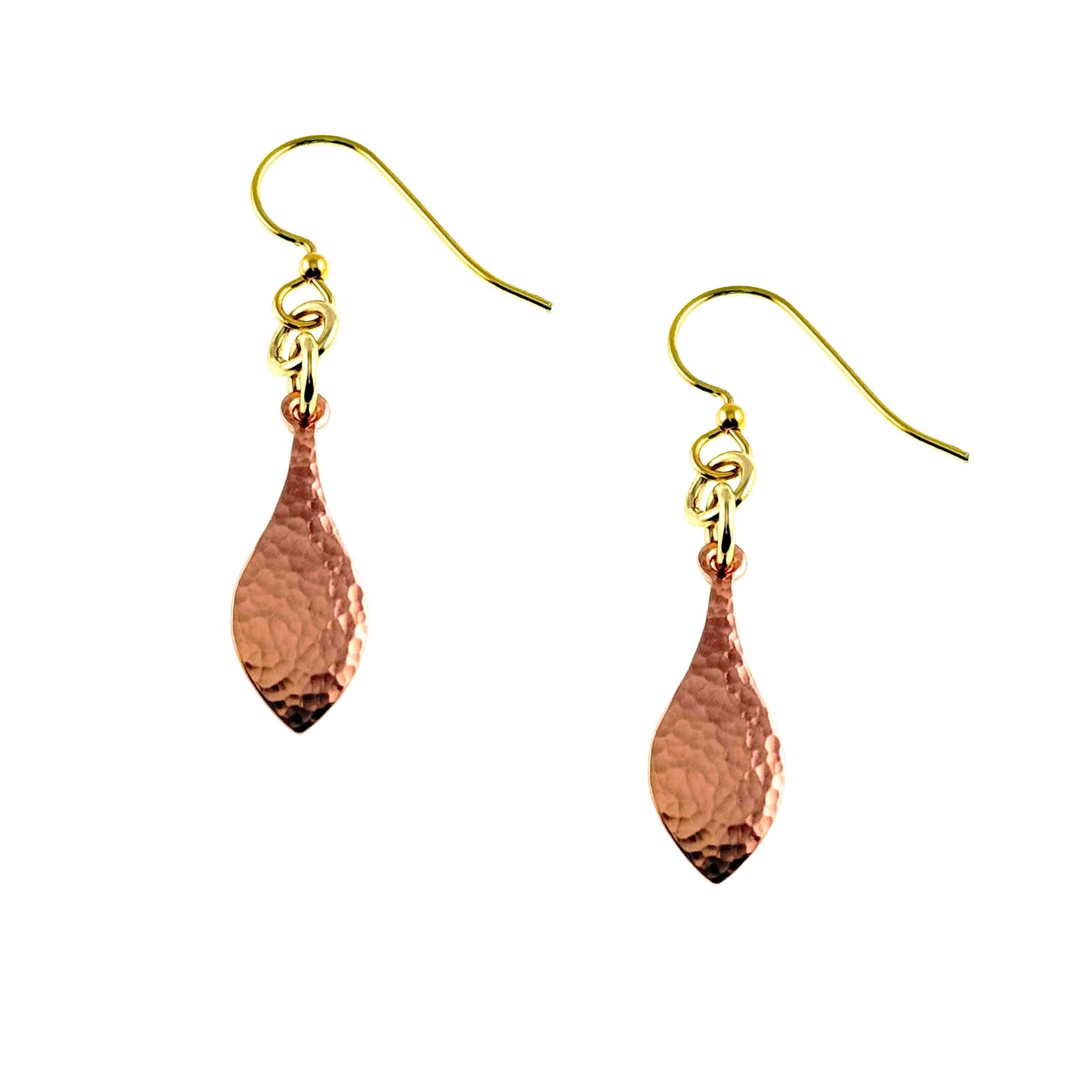Pair of hammered copper raindrop earrings displayed on a white background. Each slim copper drop has a polished hand hammered surface and hangs from a brass French ear wire with small connecting rings. The warm copper color contrasts with the golden brass ear wires, clearly showing the matching pair.