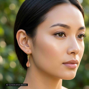 4 of 7: Close up of an AI generated female model wearing a hammered copper raindrop earring outdoors. Her dark hair is pulled back to fully show the slim copper drop hanging from a brass French ear wire. The polished hammered surface catches the light against a softly blurred green garden background.