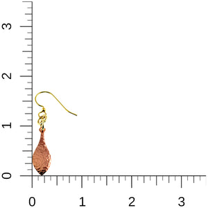 5 of 7: Hammered copper raindrop earring shown beside an inch ruler on a white background for size reference. The earring measures about 1 3/4 inches from the top of the brass French ear wire to the pointed bottom of the copper drop. The image also shows the narrow proportions and hand hammered copper surface.