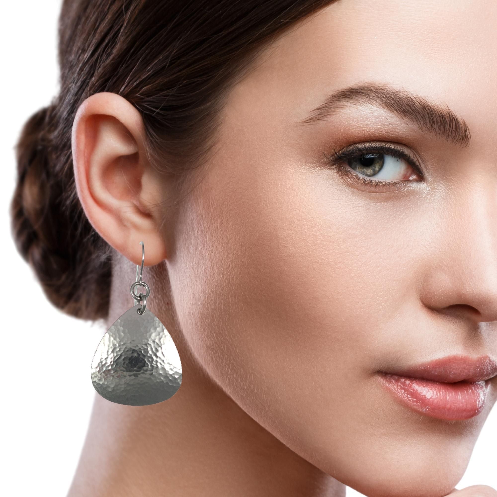 Woman Wearing Hammered Triangular Steel Drop Earrings