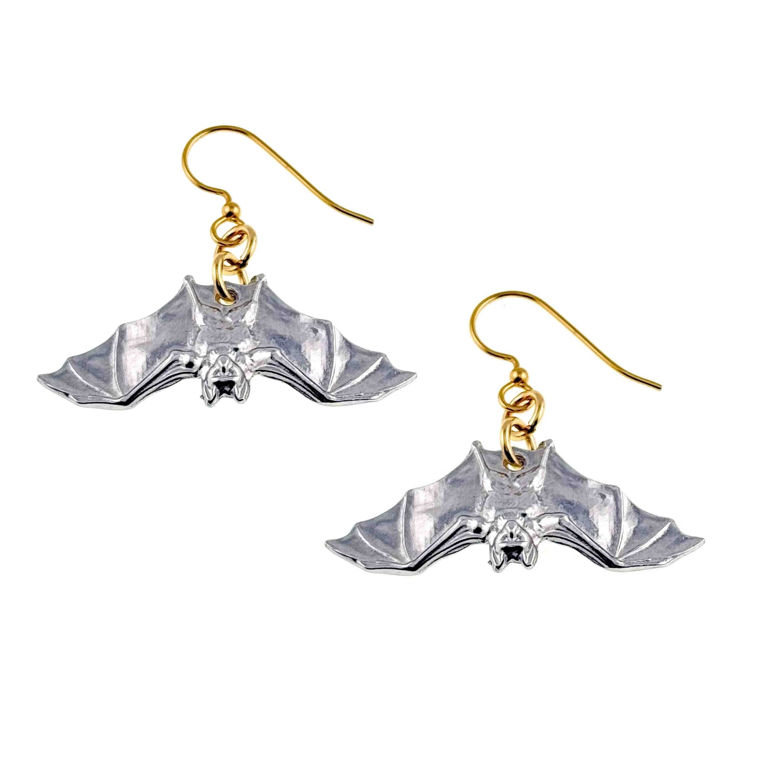 Pair of silver tone aluminum bat dangle earrings shown from the front on a white background. Each earring has spread wings, raised facial details, polished highlights, and a gold tone French ear wire joined by small gold rings.