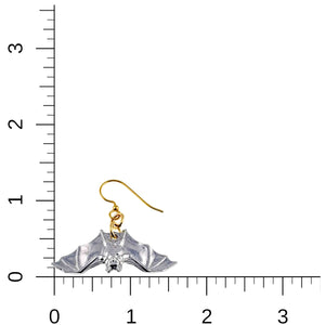 5 of 8: Polished aluminum bat dangle earring placed beside inch rulers on a white background to show scale. The earring measures about 1 3/4 inches long and 1 inch wide, including the spread wing bat and gold tone French ear wire.