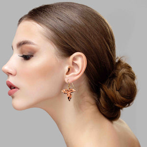 5 of 7: A Chic Woman Wearing Ivy Leaf Copper Earrings