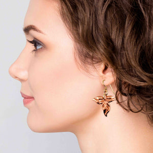 6 of 7: A Stylish Woman Wearing Ivy Leaf Copper Earrings
