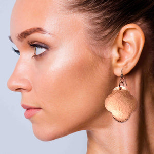 2 of 7: An Elegant Woman Wearing Large Hammered Copper Clover Drop Earrings