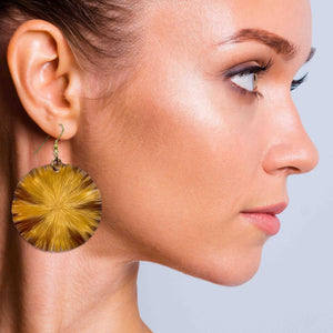 2 of 7: A Stunning Woman Wearing a Pair of Large Light Orange Anodized Lily Pad Drop Earrings