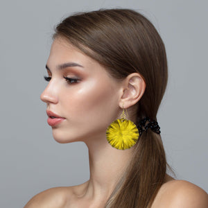 2 of 7: Stunning Woman Wearing Large Canary Yellow Lily Pad Anodized Aluminum Leaf Earrings