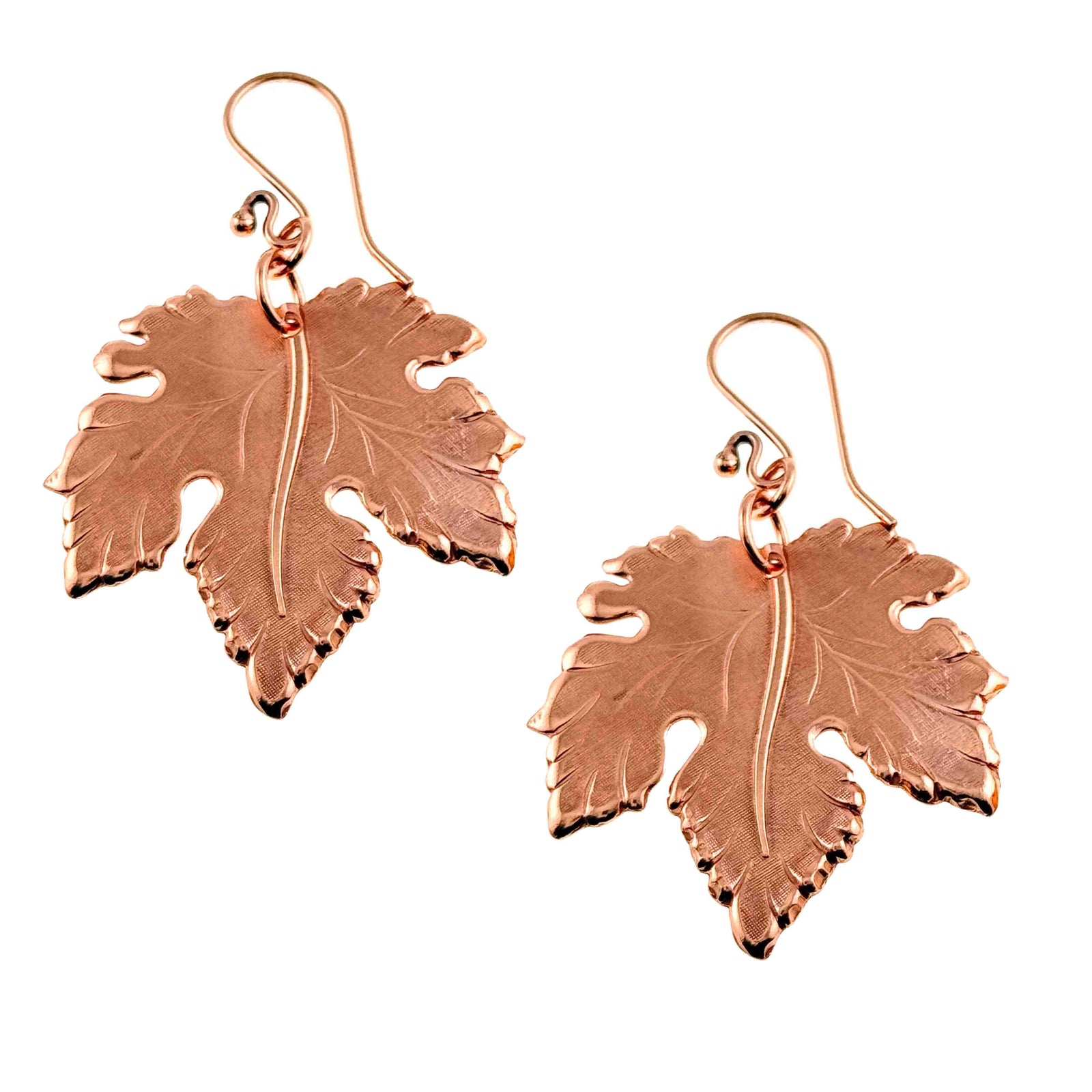 Pair of Large Maple Leaf Copper Dangle Earrings on a white background