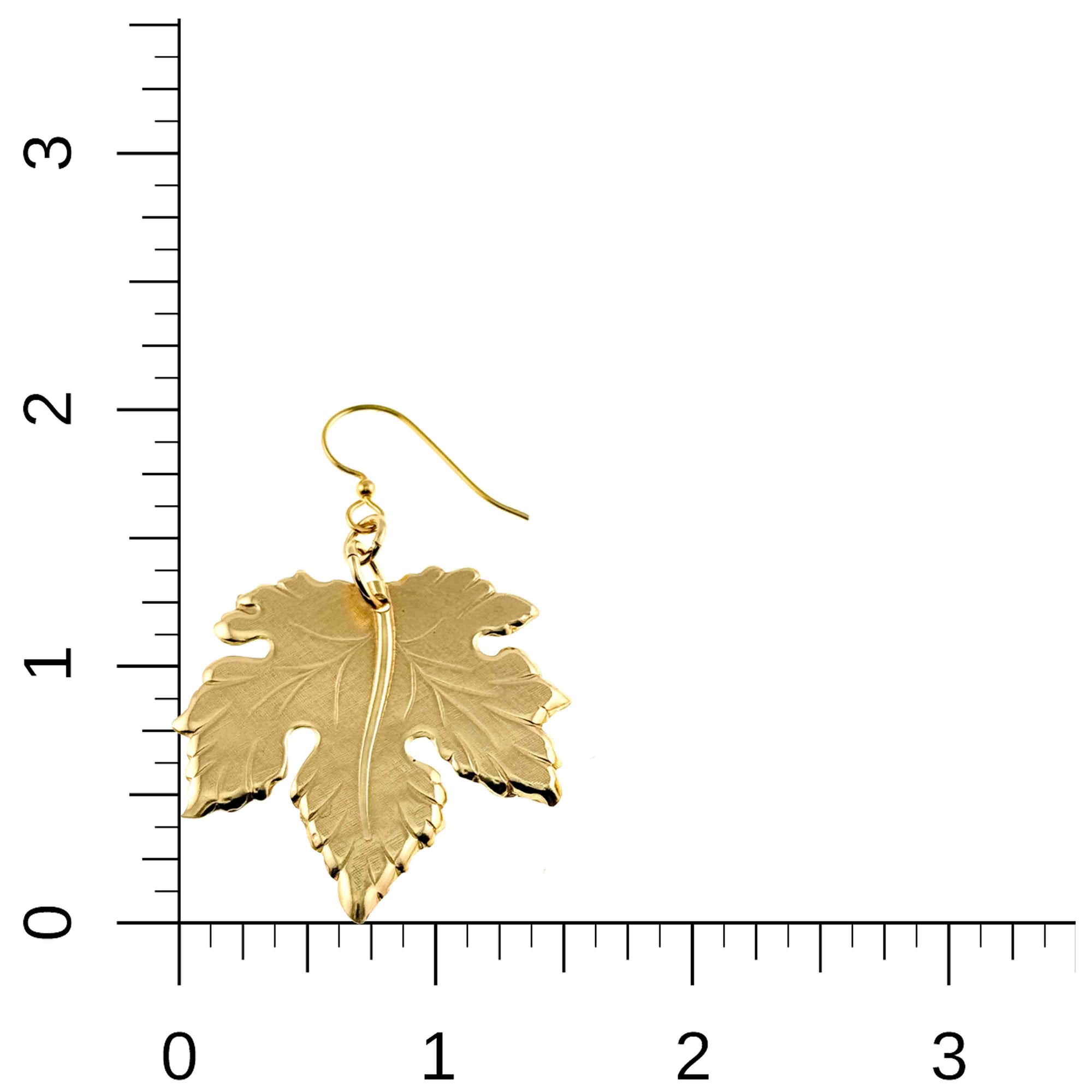 Large Maple Leaf Nu Gold Brass Dangle Earrings on a white background with a ruler for scale.