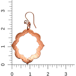 5 of 7: A Pair of Large Pierced Hammered Copper Arabesque Flower Earrings on a Ruler for Size Dimensions