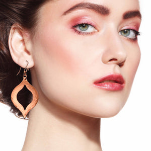 4 of 7: A Stunning Woman Wearing Large Pierced Hammered Copper Marrakesh Earrings