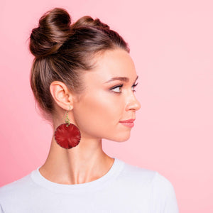 2 of 7: A Chic Woman Wearing Large Red Anodized Aluminum Lily Pad Earrings