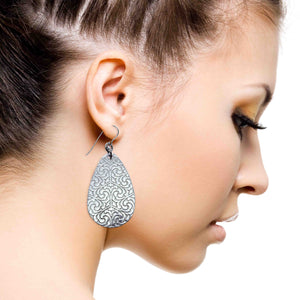 8 of 8: A Chic Woman Wearing Damask Embossed Large Aluminum Teardrop Earrings