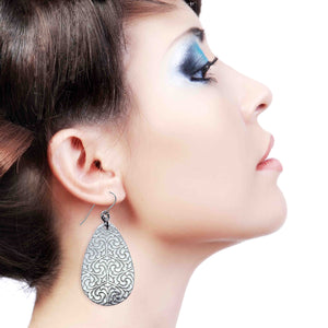 2 of 8: A Stunning Woman Wearing Damask Embossed Large Aluminum Teardrop Earrings