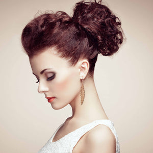 4 of 7: Stunning Woman Wearing Long Feather Copper Drop Earrings