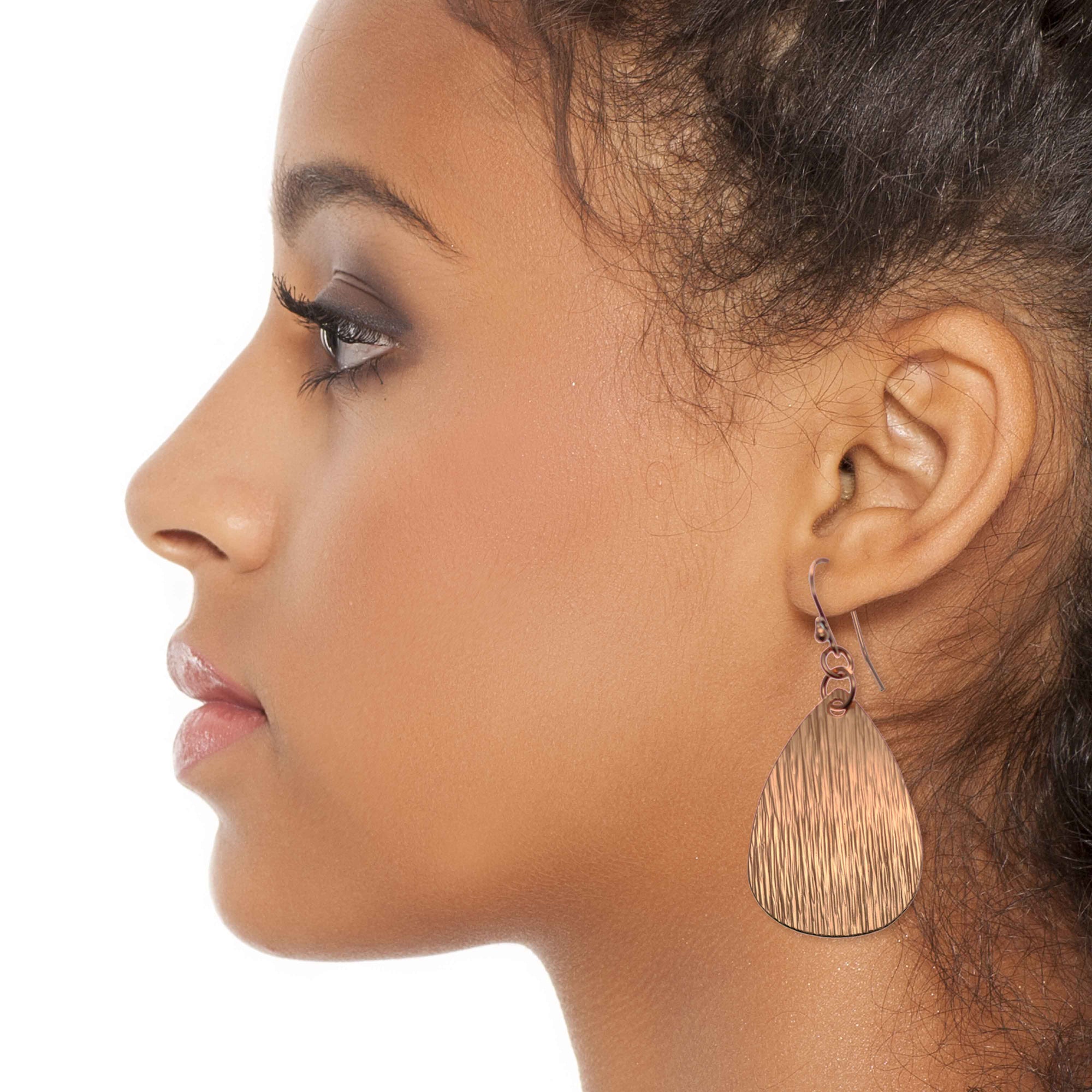Fashionable Woman Wearing Medium Bark Embossed Copper Teardrop Earrings