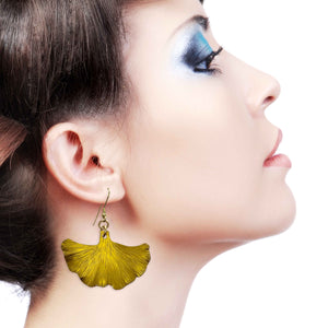 2 of 8: A Stunning Woman Wearing Medium Canary Yellow Anodized Ginkgo Leaf Earrings