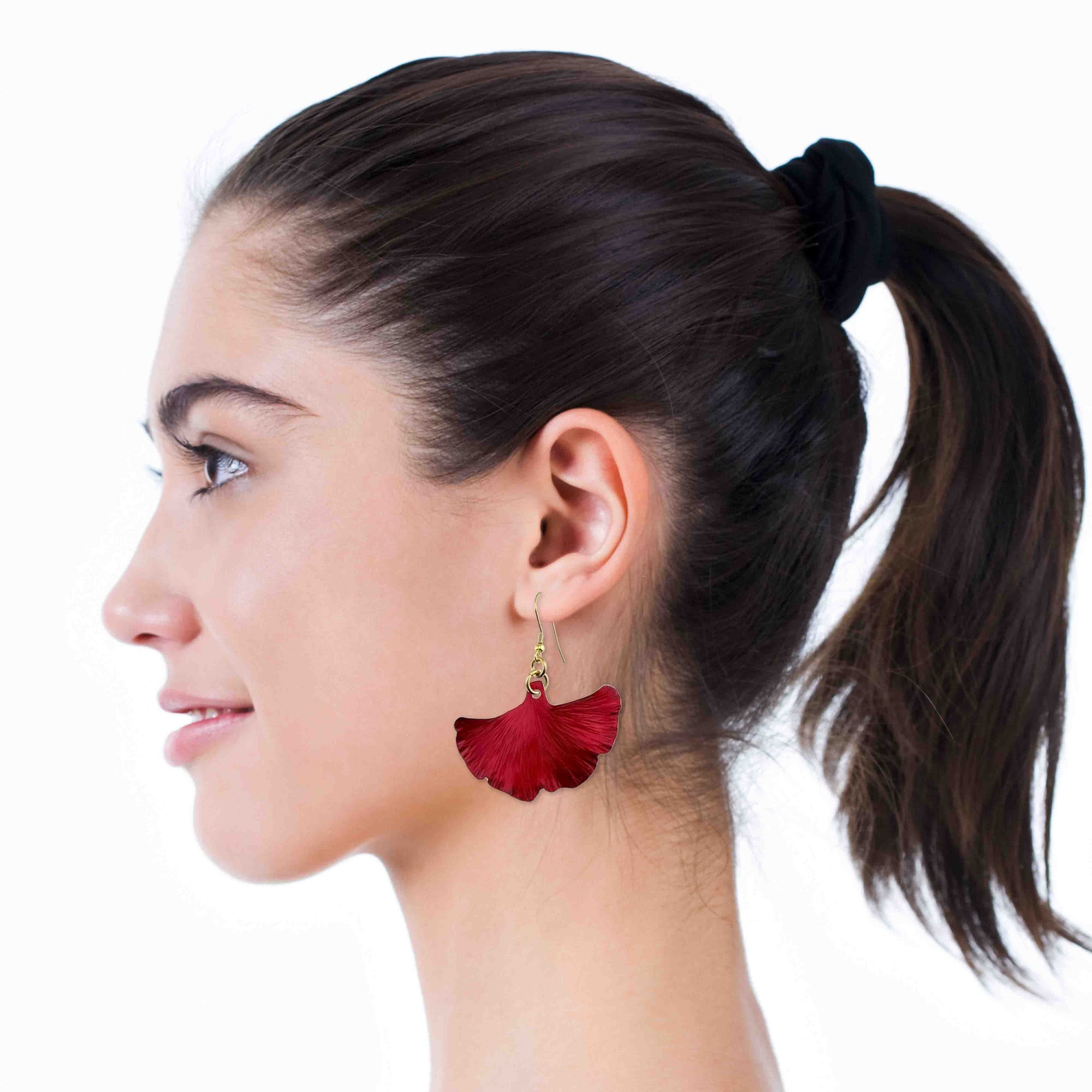 Smiling Woman Wearing Medium Candy Apple Red Anodized Aluminum Ginkgo Leaf Earrings