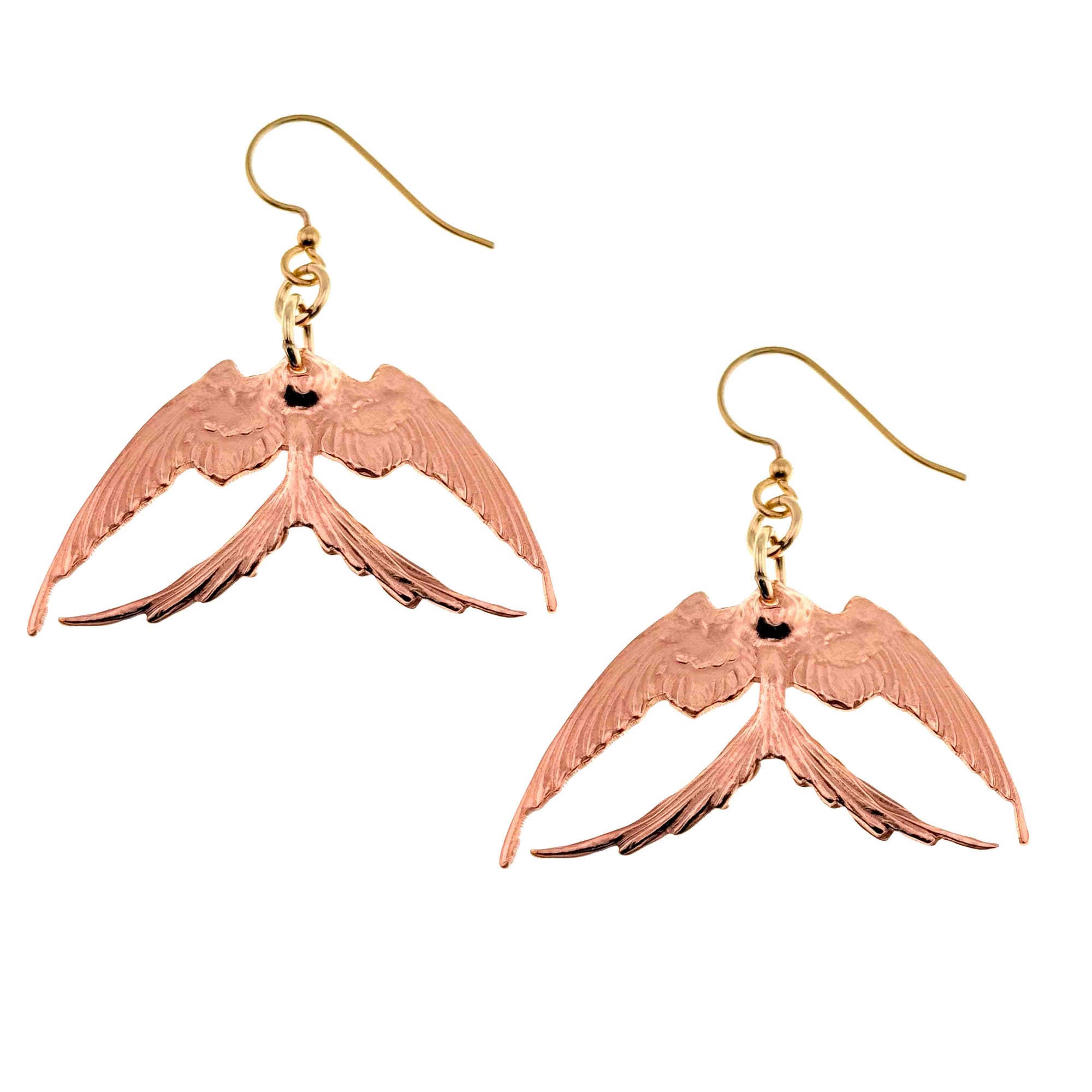 A Pair of Medium Copper Swallow Earrings on a White Background
