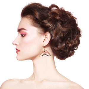 6 of 7: A Fashionable Woman Wearing Medium Copper Swallow Earrings