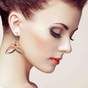 2 of 7: An Elegant Woman Wearing Medium Copper Swallow Earrings