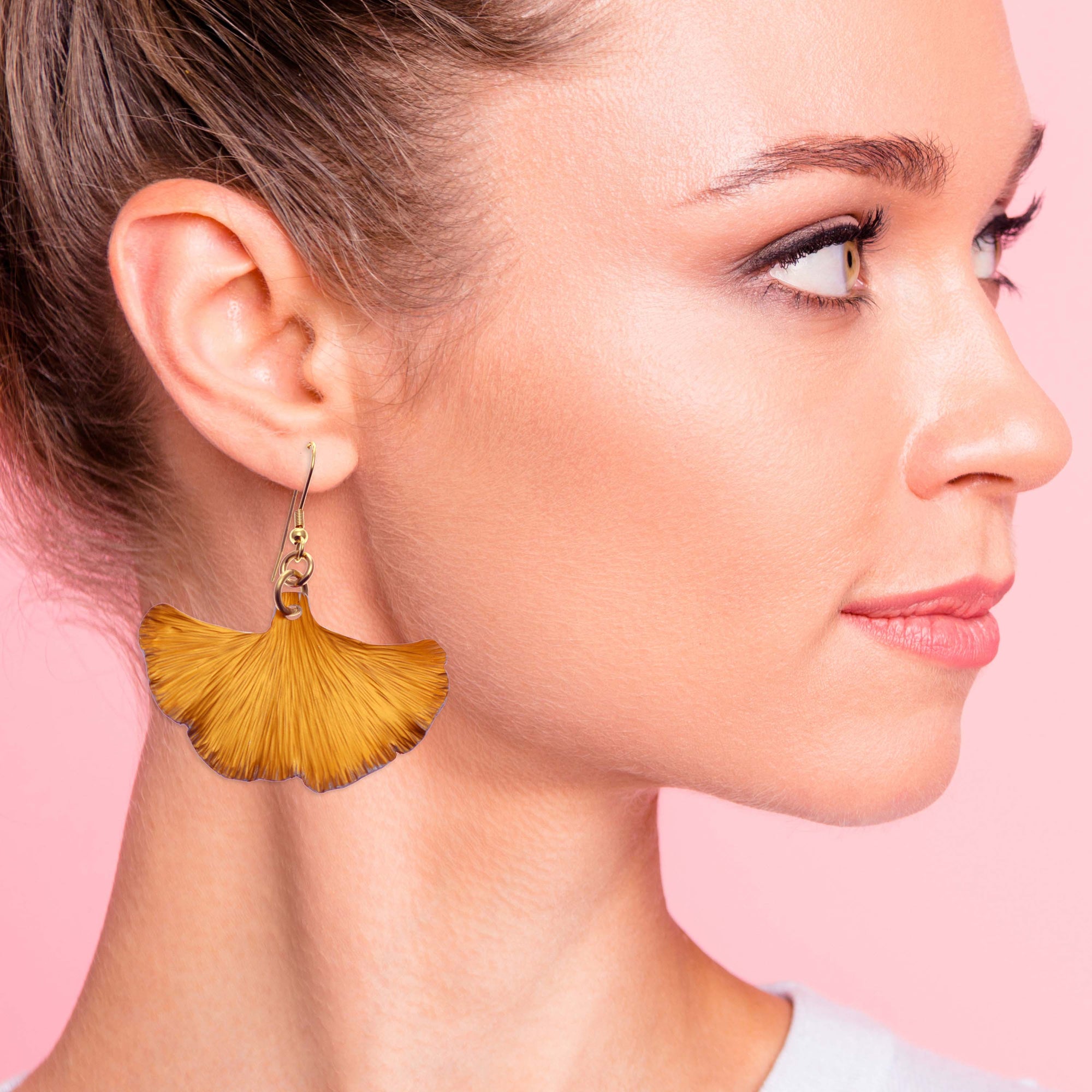 A woman wearing Orange Anodized Aluminum Ginkgo Leaf Drop Earrings, , adding a touch of elegance to her outfit