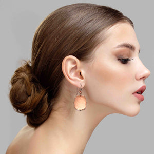 2 of 6: An Elegant Woman Wearing Medium Hammered Copper Arabesque Shield Earrings