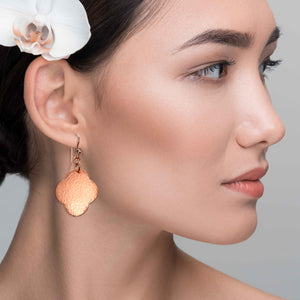 6 of 7: A Chic Woman Wearing Medium Hammered Copper Clover Drop Earrings