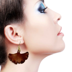 4 of 7: A Stunning Woman Wearing Medium Henna Brown Anodized Ginkgo Leaf Earrings