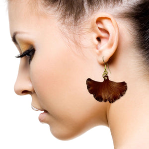 2 of 7: An Elegant Woman Wearing Medium Henna Brown Anodized Ginkgo Leaf Earrings