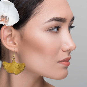 6 of 7: Elegant Woman Wearing Medium Light Orange Anodized Ginkgo Leaf Drop Earrings