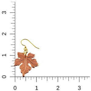 5 of 7: Medium Maple Leaf Copper Dangle Earring on a ruler for scale