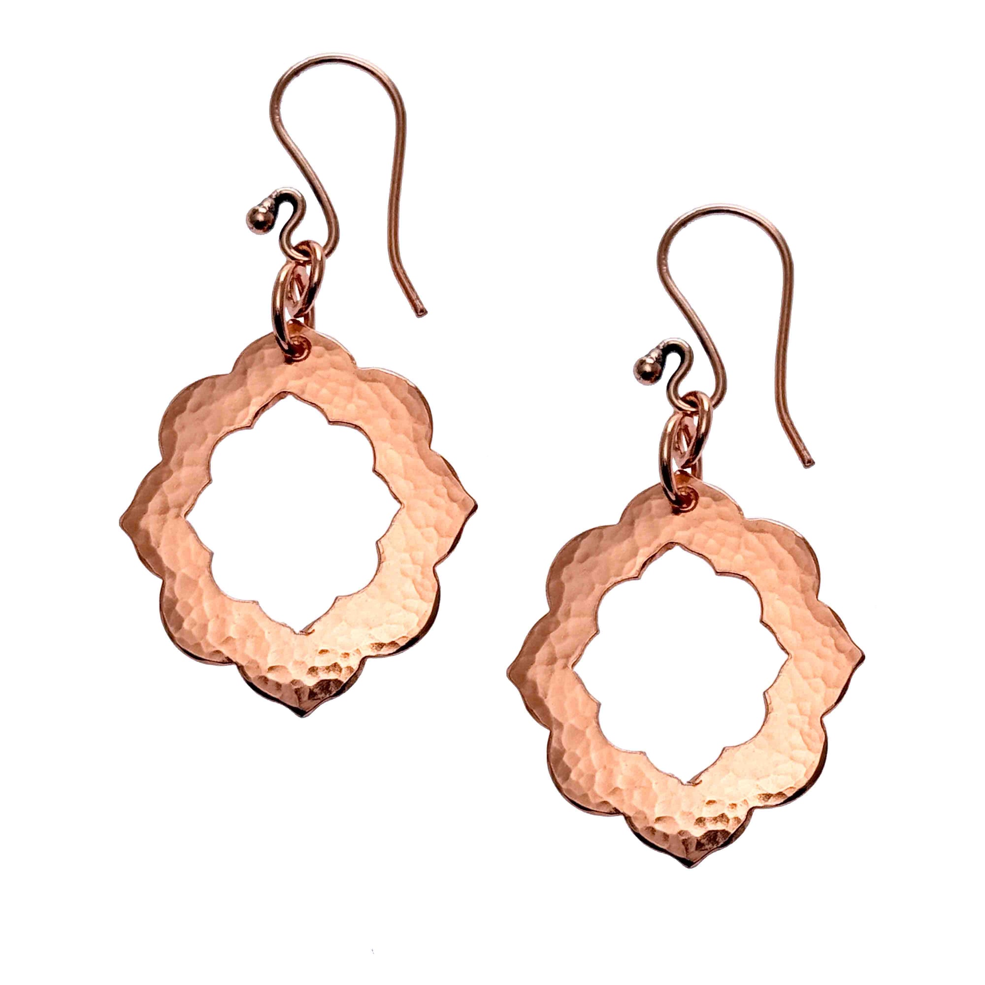 A Pair of Medium Pierced Hammered Copper Arabesque Flower on a White Background