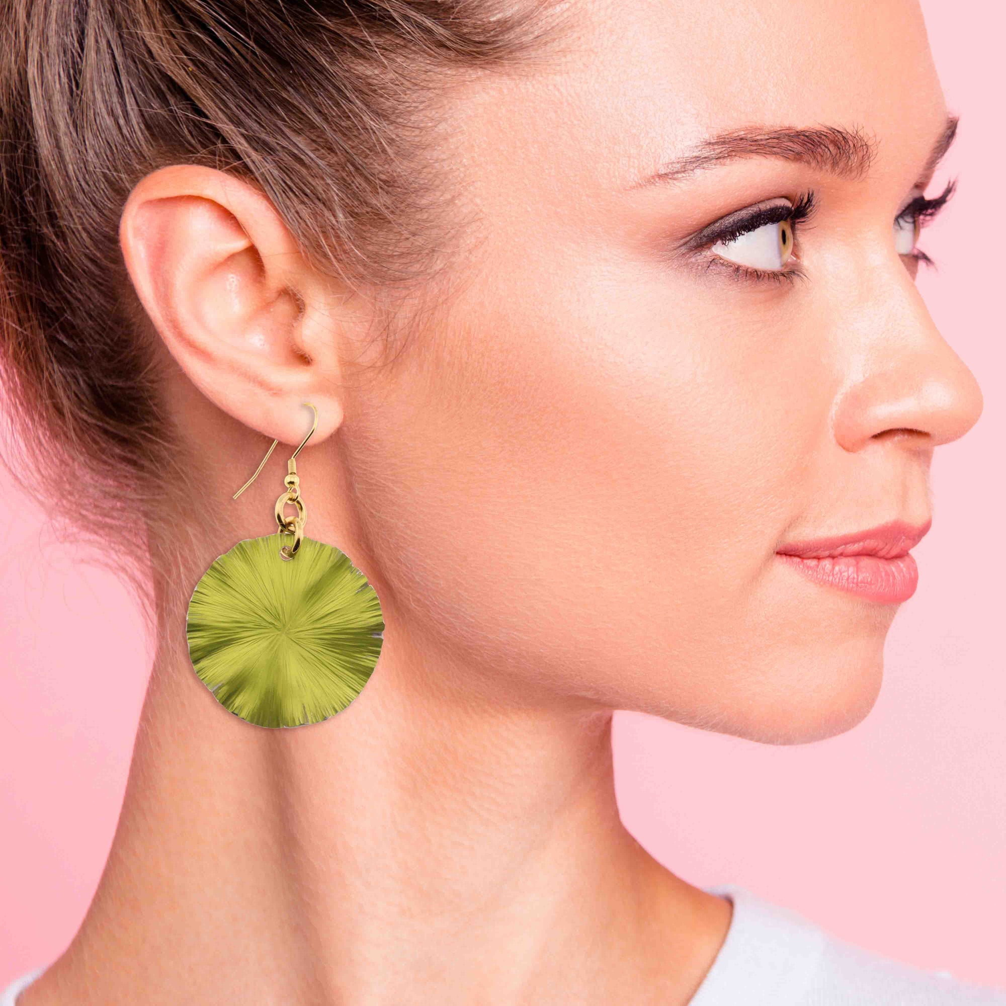 An Elegant Woman Wearing Medium Sour Candy Apple Anodized Aluminum Lily Pad Earrings