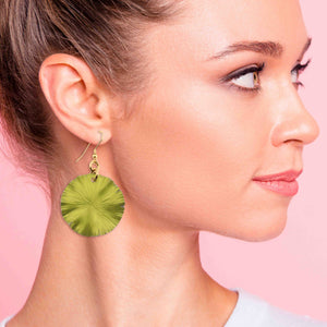 2 of 8: An Elegant Woman Wearing Medium Sour Candy Apple Anodized Aluminum Lily Pad Earrings