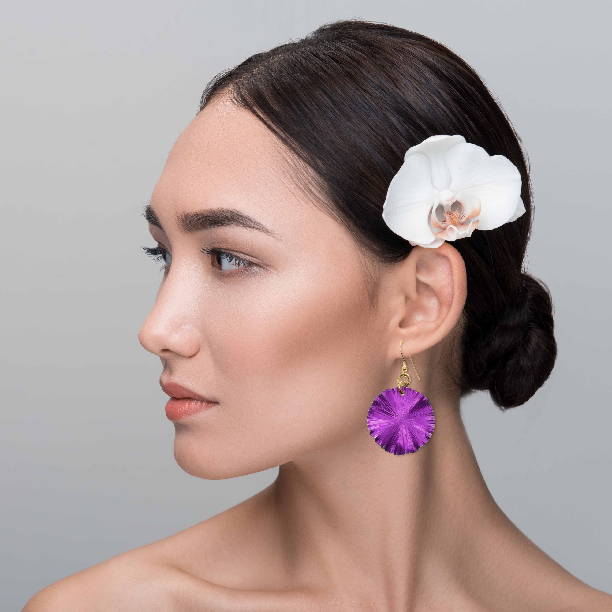 Stunning Woman Wearing Violet Anodized Aluminum Lily Pad Earrings