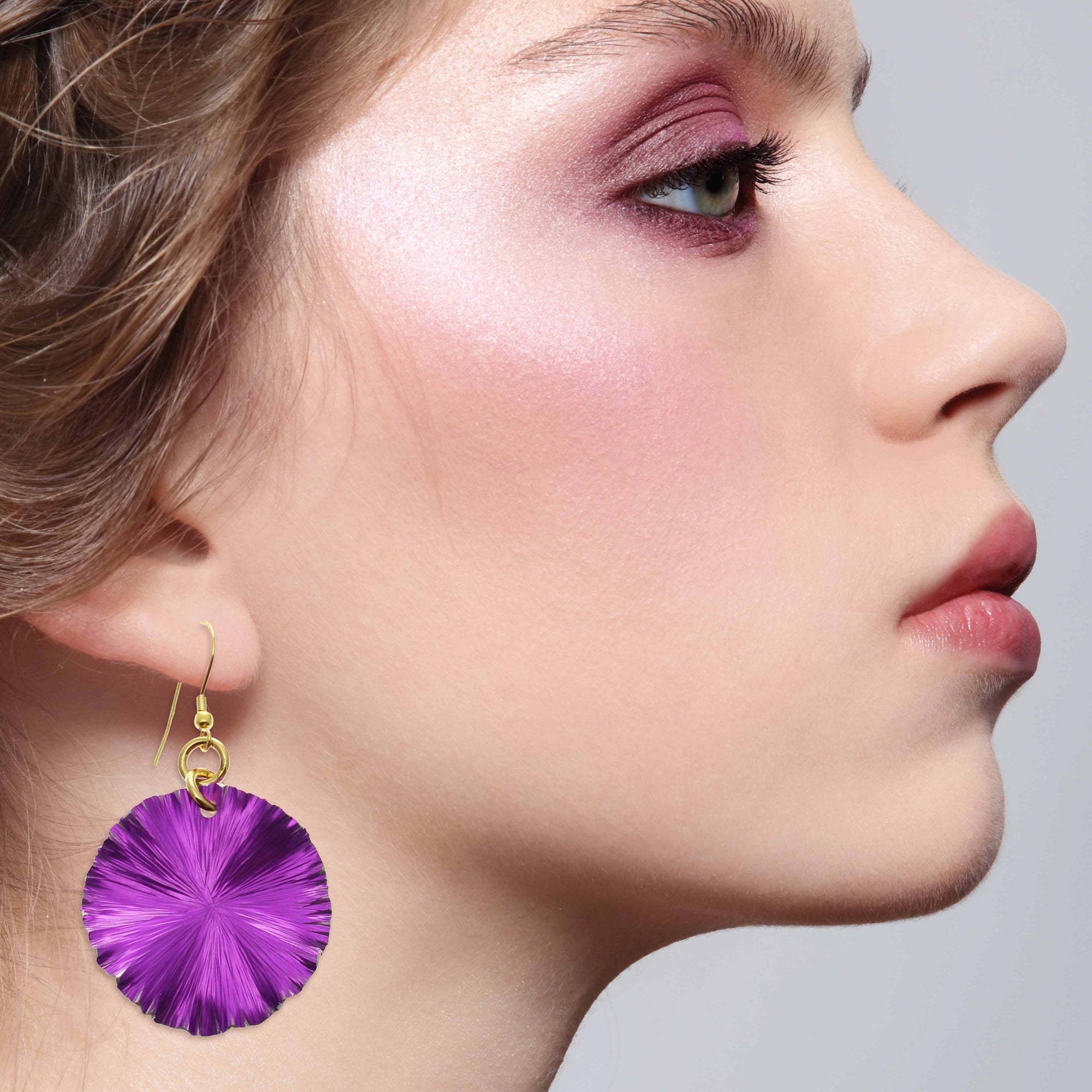 Stunning Woman Wearing Violet Anodized Aluminum Lily Pad Earrings