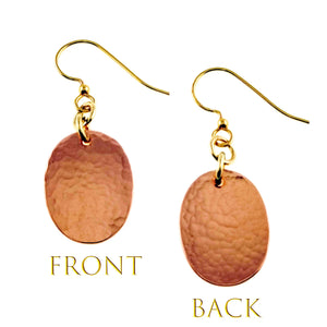 3 of 7: Front and back views of Mini Hammered Copper Oval Disc Earrings on a white background. Both earrings feature warm polished copper oval drops with visible hand hammered texture and brass French ear wires. The comparison shows the textured appearance and natural copper color on both sides of the handcrafted earrings.