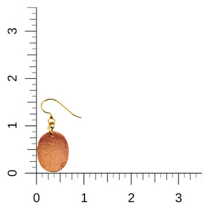5 of 7: Mini Hammered Copper Oval Disc Earring shown beside inch rulers for scale. The earring measures about 1 1/2 inches from the top of the brass French ear wire to the bottom of the copper disc. The oval copper drop is about 5/8 inch wide and features a polished hand hammered texture on a white background.
