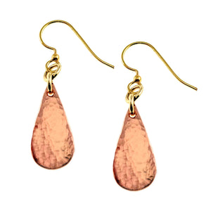 1 of 7: Pair of Mini Hammered Copper Teardrop Earrings displayed on a clean white background. Each earring features a slim hand hammered copper teardrop with warm mirror polished color and a brass French ear wire.