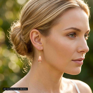 6 of 7: AI generated model wearing a Mini Hammered Copper Teardrop Earring in warm outdoor light. The petite hand hammered copper teardrop hangs from a brass French ear wire and reflects the sunlight. The model has blonde hair styled in a loose updo, with a softly blurred green garden setting behind her.