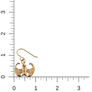 5 of 7: Mini Vampire Bat Bronze Dangle Earrings on a ruler for scale